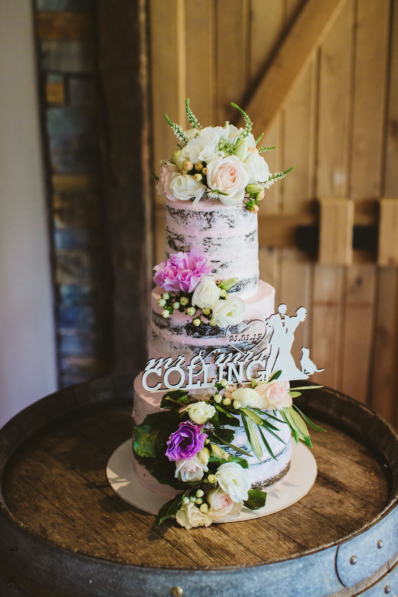 Floral wedding cake on barrel